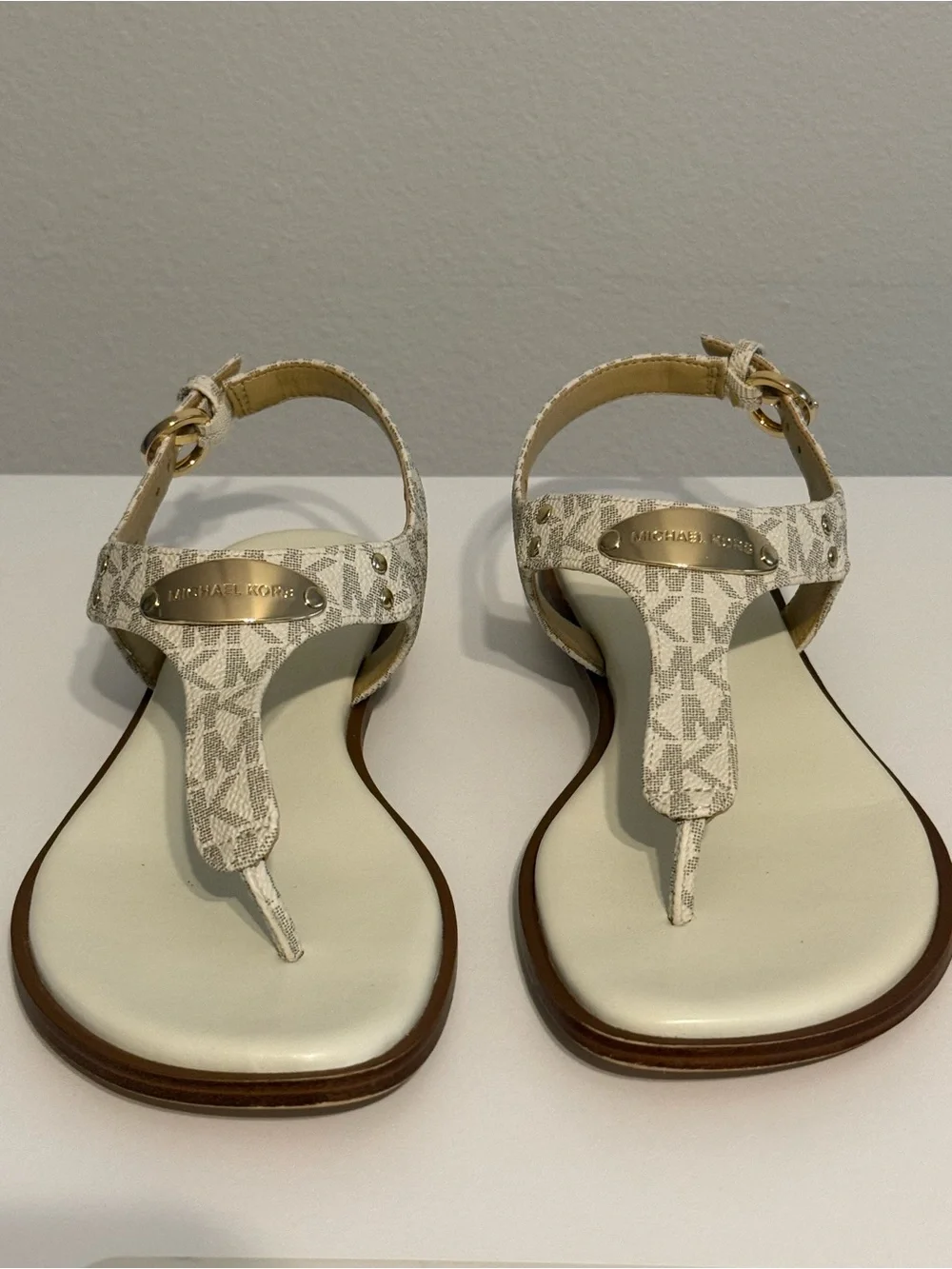 Michael Kors Cream/White Logo T-Strap Sandals with Gold Plaque